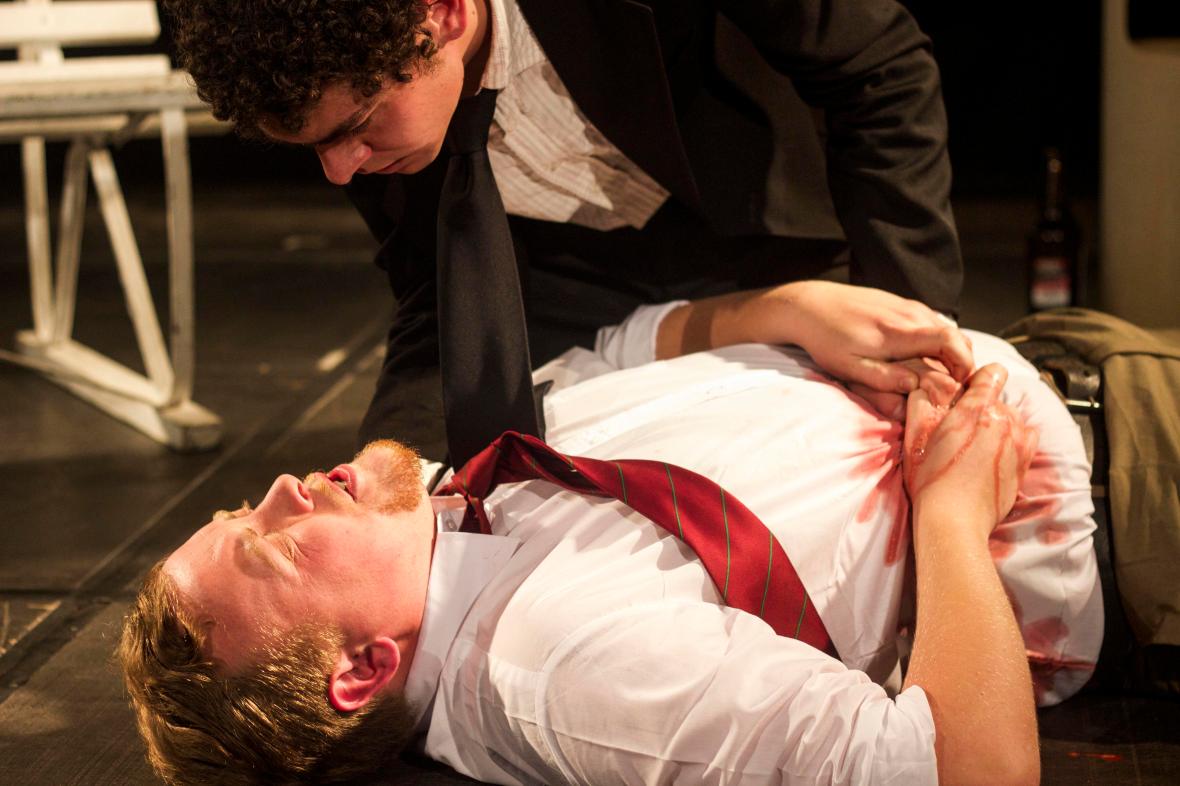 James Sulter looks over Chad Emslie after he has been stabbed during a performance of Character Door on 2 July 2015 at the National Arts Festival.  Two characters try to break free of their script, but discover that the boundaries between theatre and life are quick to blur, and violence bleeds into one as easily as the other.  (Photo: CuePix/ Amanda Horsfield)